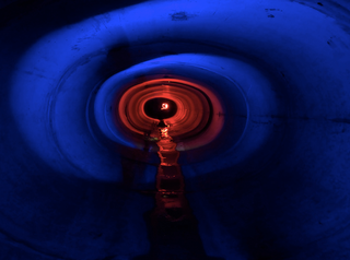 Illustration for article titled Unreal photographs of tunnels look like portals into the underworld